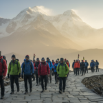 Pilgrims walking along a paved mountain path surrounded by Himalayan peaks during the Chardham Yatra.