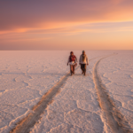 Sunset over the white salt desert of the Rann of Kutch with golden light reflecting on the crust.